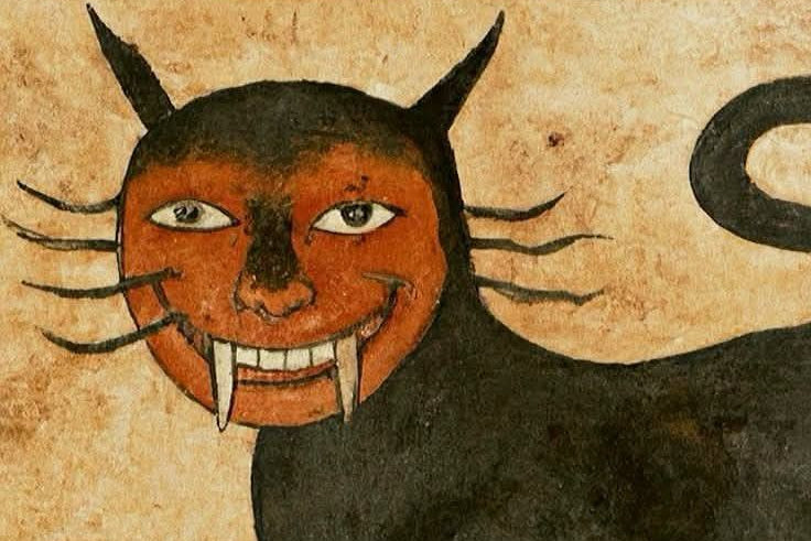 Black cat with a devilish face on a textured beige background